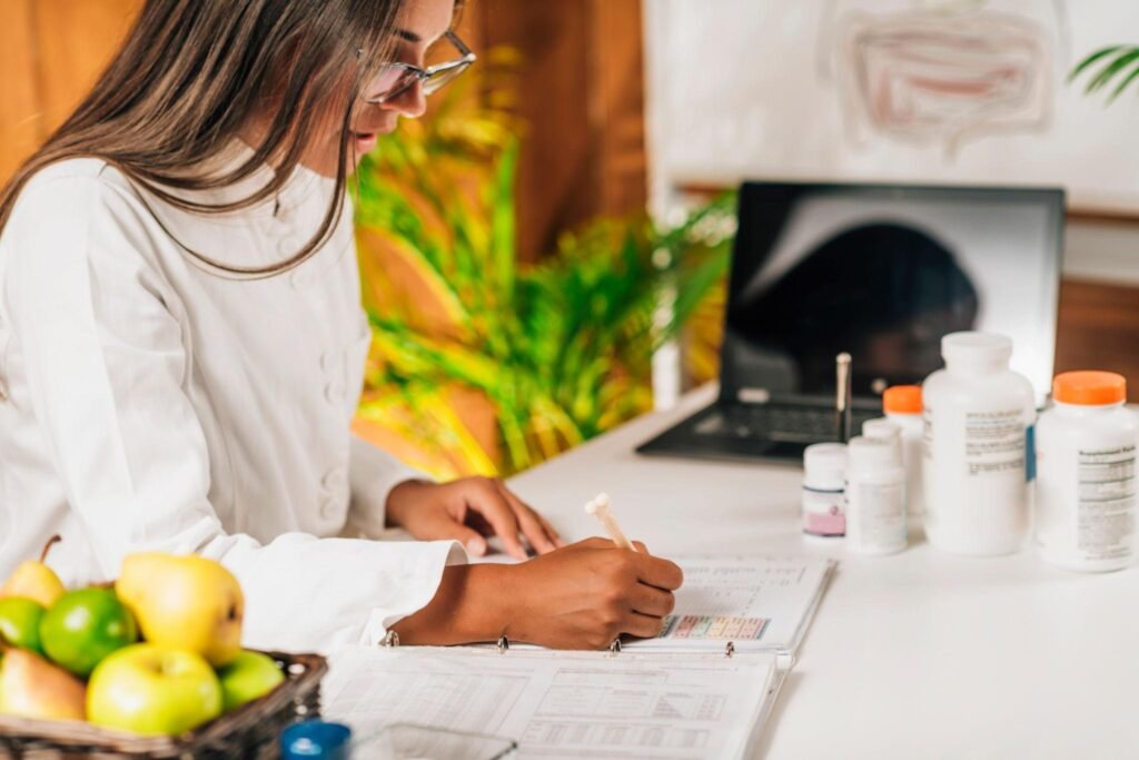 Girl at desk with pills